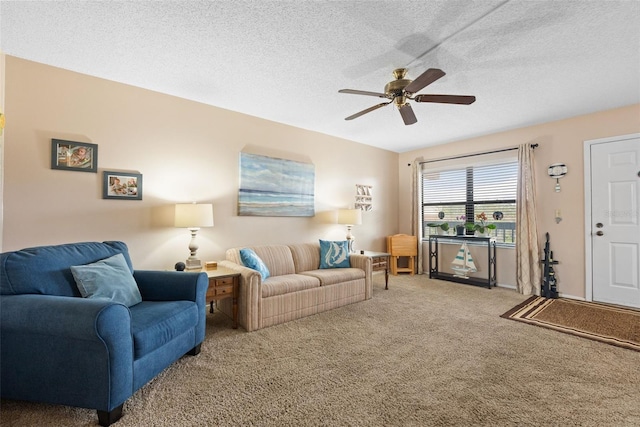 living room with a textured ceiling, carpet, and a ceiling fan