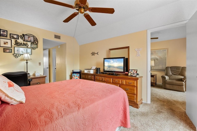 bedroom featuring a ceiling fan, visible vents, baseboards, vaulted ceiling, and light colored carpet