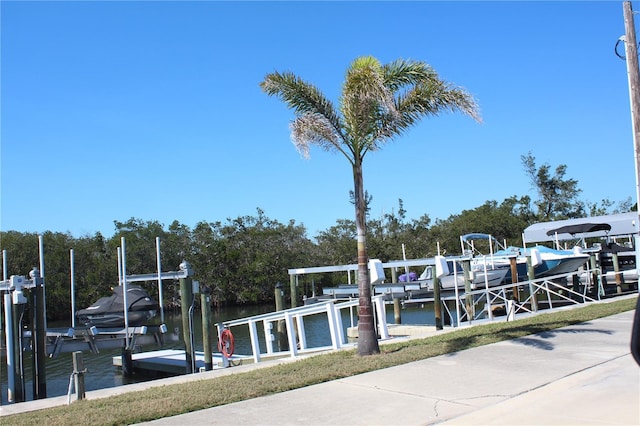 view of dock with a water view and boat lift