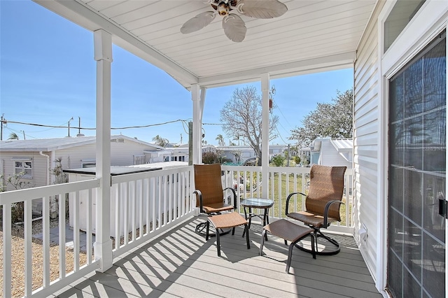 sunroom with a ceiling fan