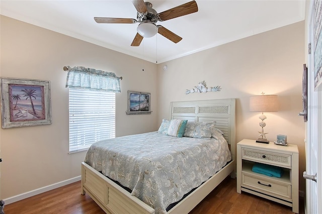 bedroom with dark wood-style floors, baseboards, and ceiling fan