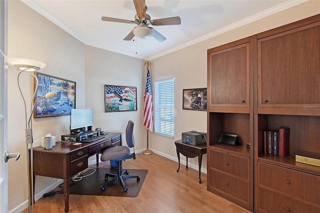 home office featuring baseboards, light wood-type flooring, ceiling fan, and ornamental molding