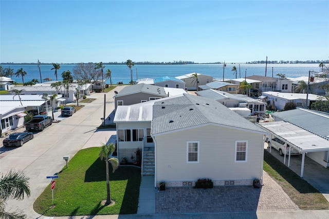 aerial view with a residential view and a water view