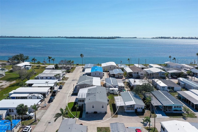 bird's eye view with a residential view and a water view