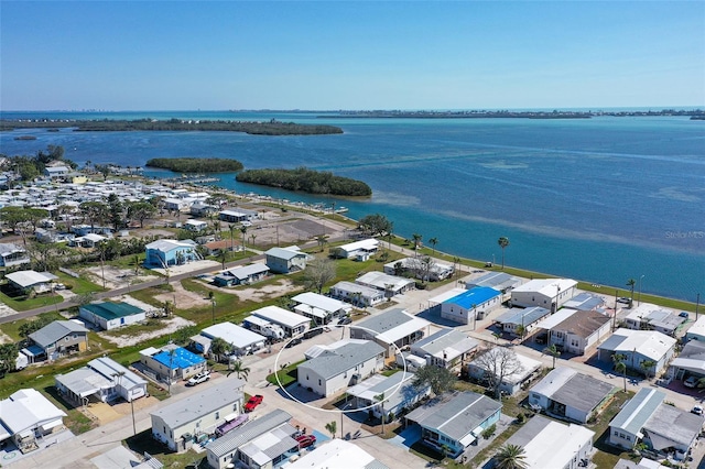 birds eye view of property featuring a residential view and a water view