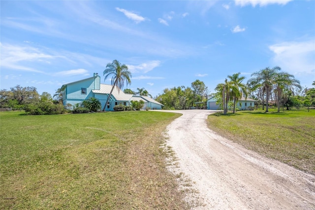 view of street featuring dirt driveway