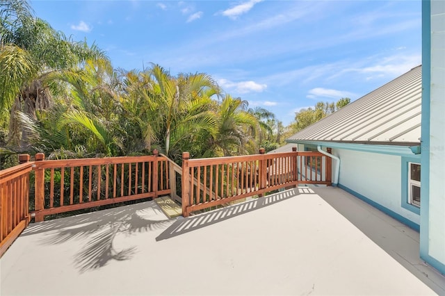 wooden deck with a patio area