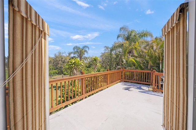 wooden terrace featuring a patio area