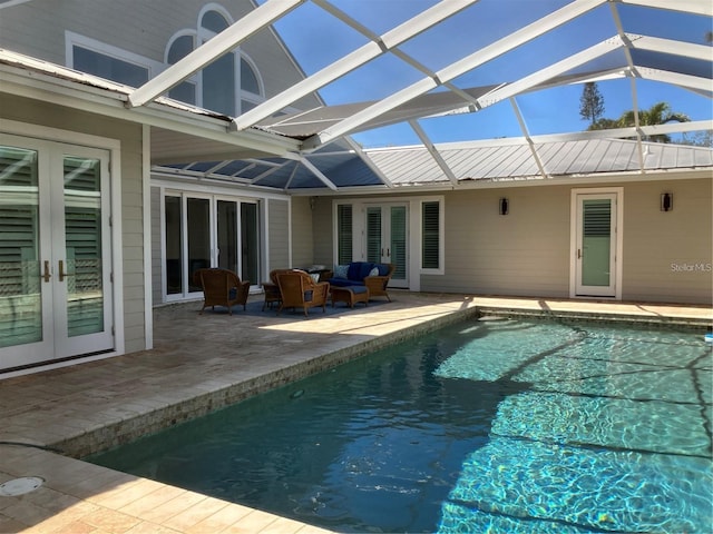 pool featuring a patio area, french doors, a lanai, and an outdoor hangout area