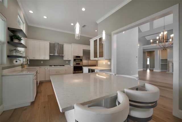 kitchen with wall chimney range hood, open shelves, backsplash, and a kitchen island