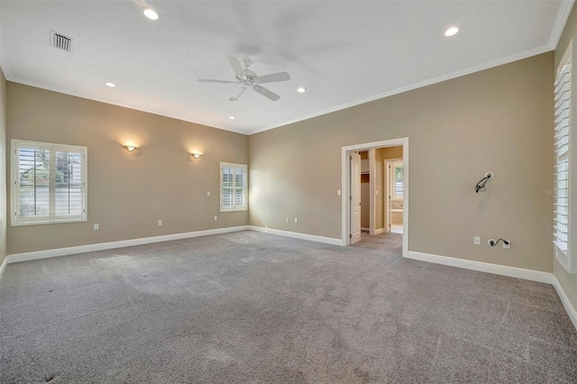 unfurnished room featuring carpet flooring, baseboards, ornamental molding, and a ceiling fan