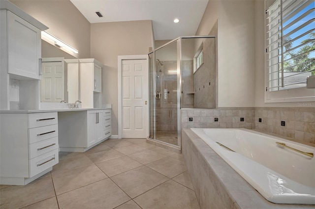 full bathroom featuring vanity, tile patterned floors, a shower stall, and a bath