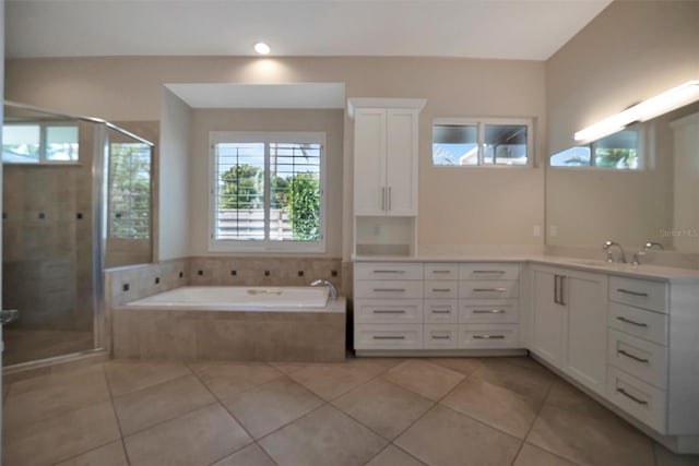 bathroom with vanity, a garden tub, tile patterned floors, and a shower stall