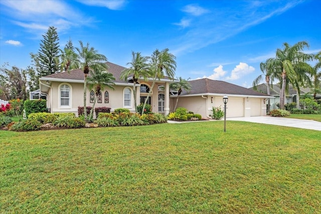 ranch-style house featuring stucco siding, driveway, a front yard, and a garage