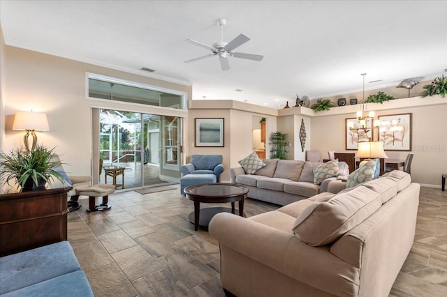 living area featuring baseboards, ceiling fan with notable chandelier, visible vents, and ornamental molding