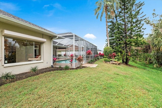 view of yard featuring a fenced in pool and a lanai