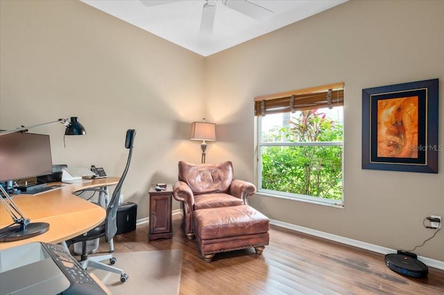 office with a ceiling fan, wood finished floors, and baseboards