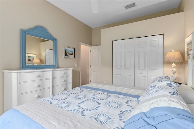 bedroom featuring a closet, visible vents, and a ceiling fan