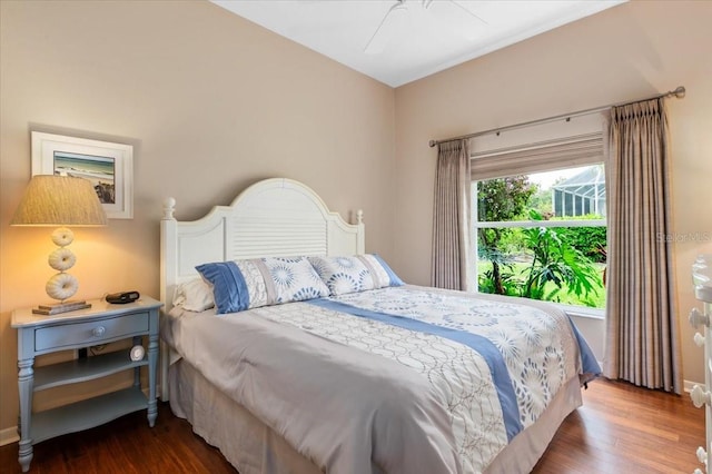 bedroom featuring a ceiling fan and wood finished floors