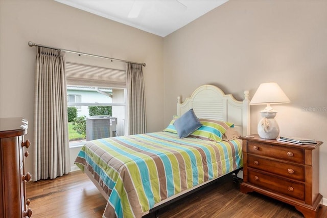 bedroom featuring a ceiling fan and wood finished floors