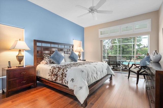 bedroom featuring wood finished floors, a ceiling fan, and access to exterior