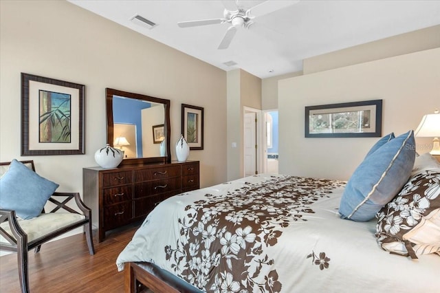 bedroom featuring visible vents, wood finished floors, and a ceiling fan