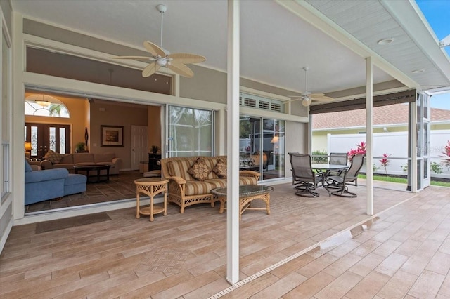 view of patio / terrace with outdoor dining space, an outdoor hangout area, a ceiling fan, and fence