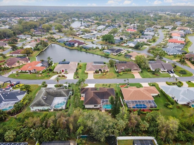 birds eye view of property featuring a residential view and a water view