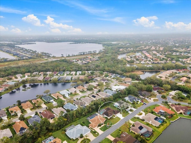 bird's eye view with a water view and a residential view