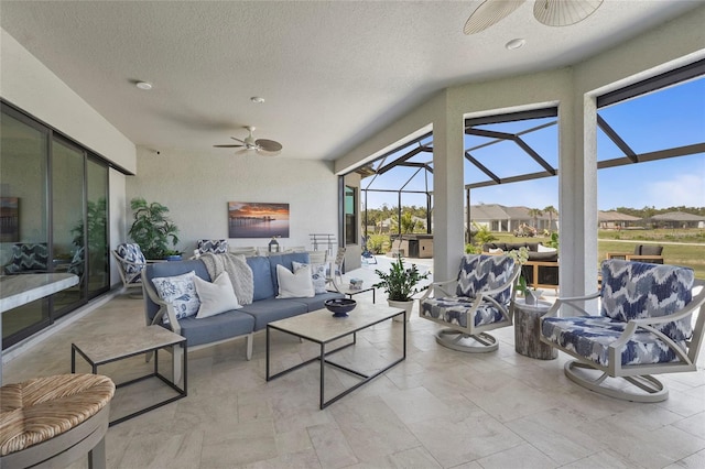 sunroom / solarium with ceiling fan