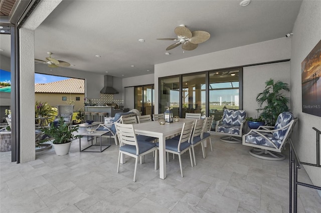 view of patio with outdoor dining area and ceiling fan