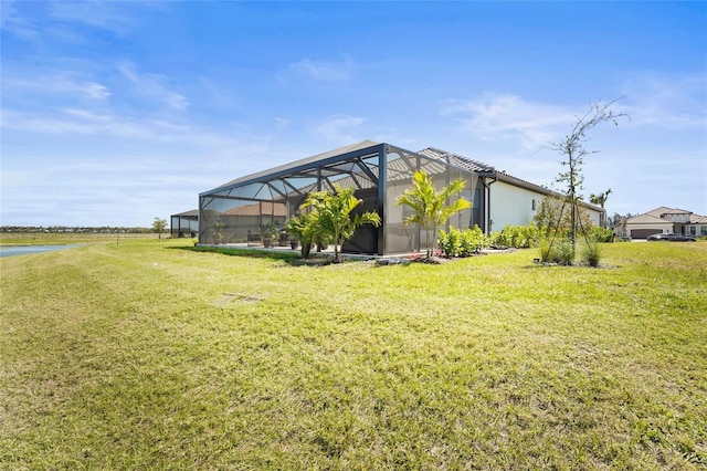 view of yard with glass enclosure