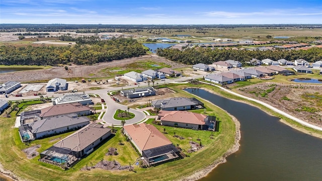 birds eye view of property featuring a water view and a residential view