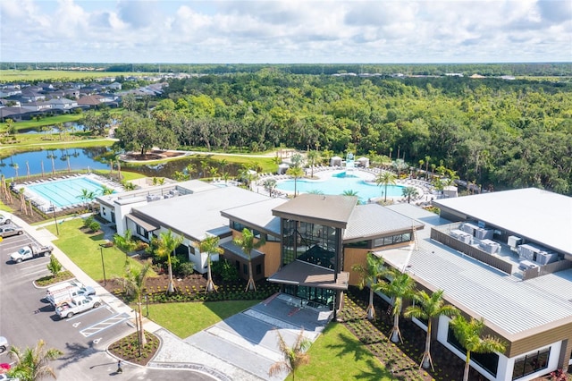 aerial view with a water view and a view of trees