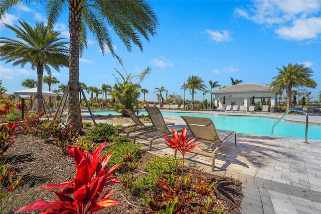 pool with a gazebo and a patio