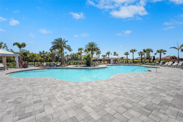 community pool featuring a gazebo and a patio area