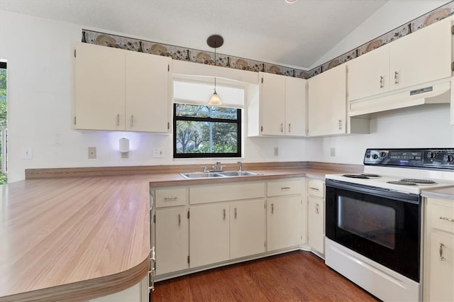 kitchen with range with electric cooktop, under cabinet range hood, light countertops, vaulted ceiling, and a sink