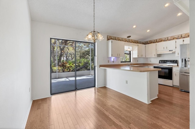 kitchen with light wood-type flooring, stainless steel refrigerator with ice dispenser, under cabinet range hood, range with electric stovetop, and lofted ceiling