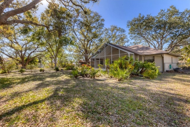 view of yard with a sunroom