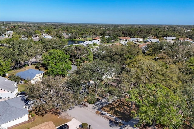 drone / aerial view featuring a view of trees