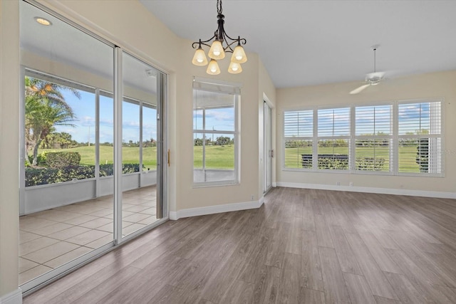 interior space with a wealth of natural light and a chandelier