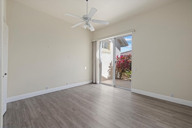 unfurnished room with ceiling fan, baseboards, and wood finished floors