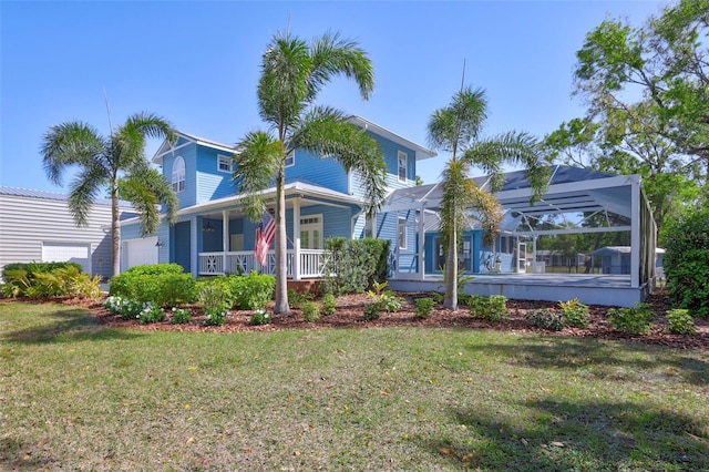 view of front of home with a garage, a porch, a lanai, and a front lawn