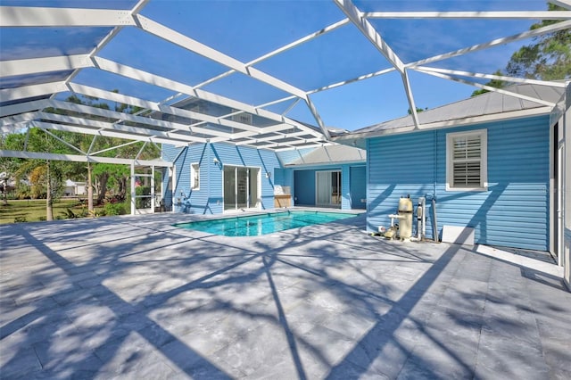 outdoor pool featuring a patio and a lanai