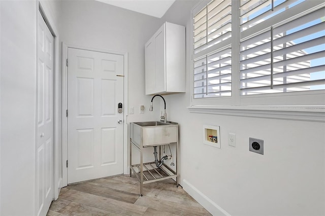 laundry room with cabinet space, light wood finished floors, baseboards, hookup for an electric dryer, and hookup for a washing machine