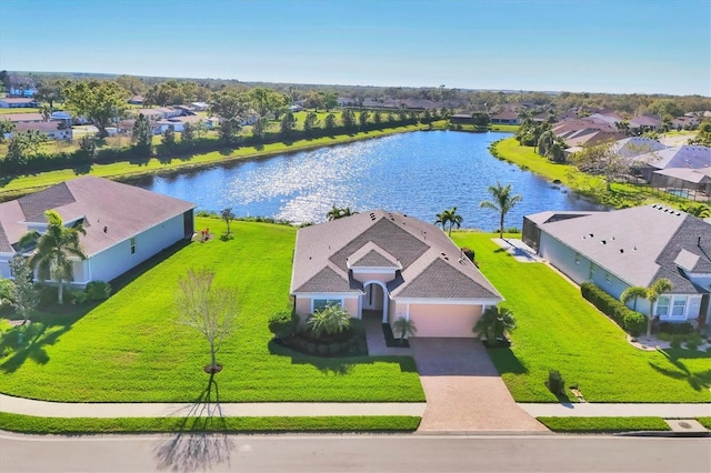 birds eye view of property featuring a residential view and a water view