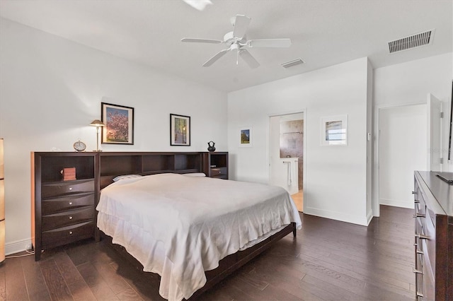 bedroom with dark wood finished floors, baseboards, visible vents, and a ceiling fan