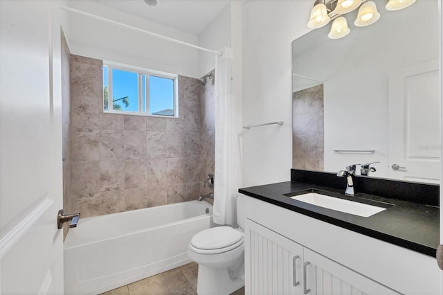 bathroom with tile patterned flooring, vanity, toilet, and shower / tub combo