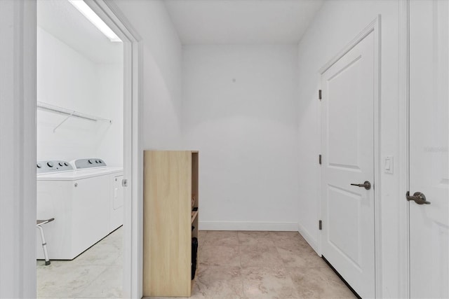 washroom featuring laundry area, independent washer and dryer, and baseboards