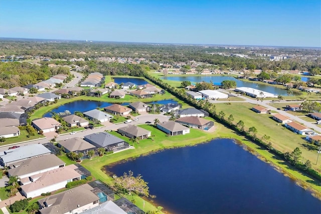 birds eye view of property featuring a residential view and a water view